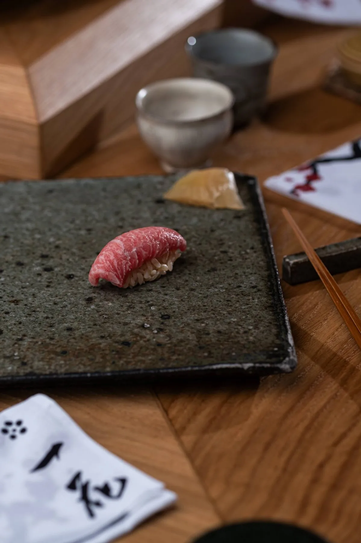 Tuna nigiri on a stone plate