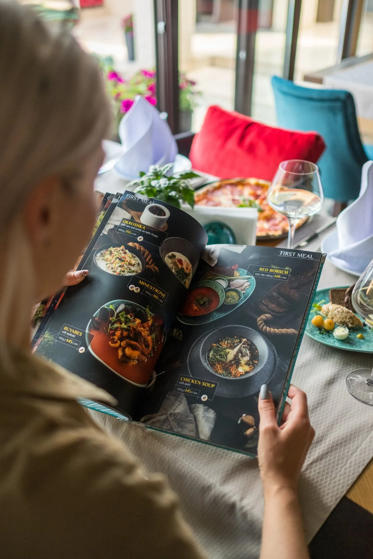 A guest reading the menu