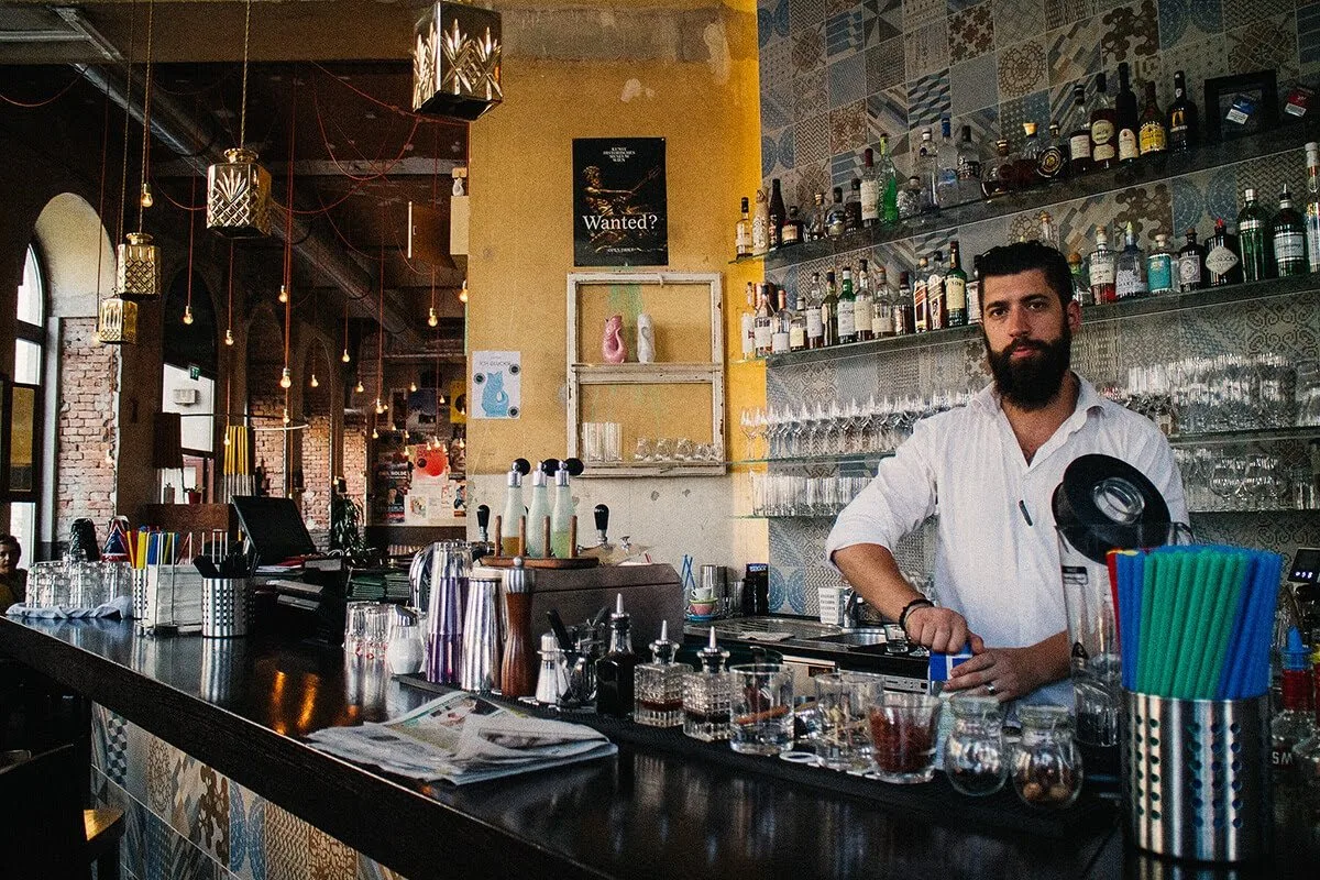 Bartender behind a restaurant bar