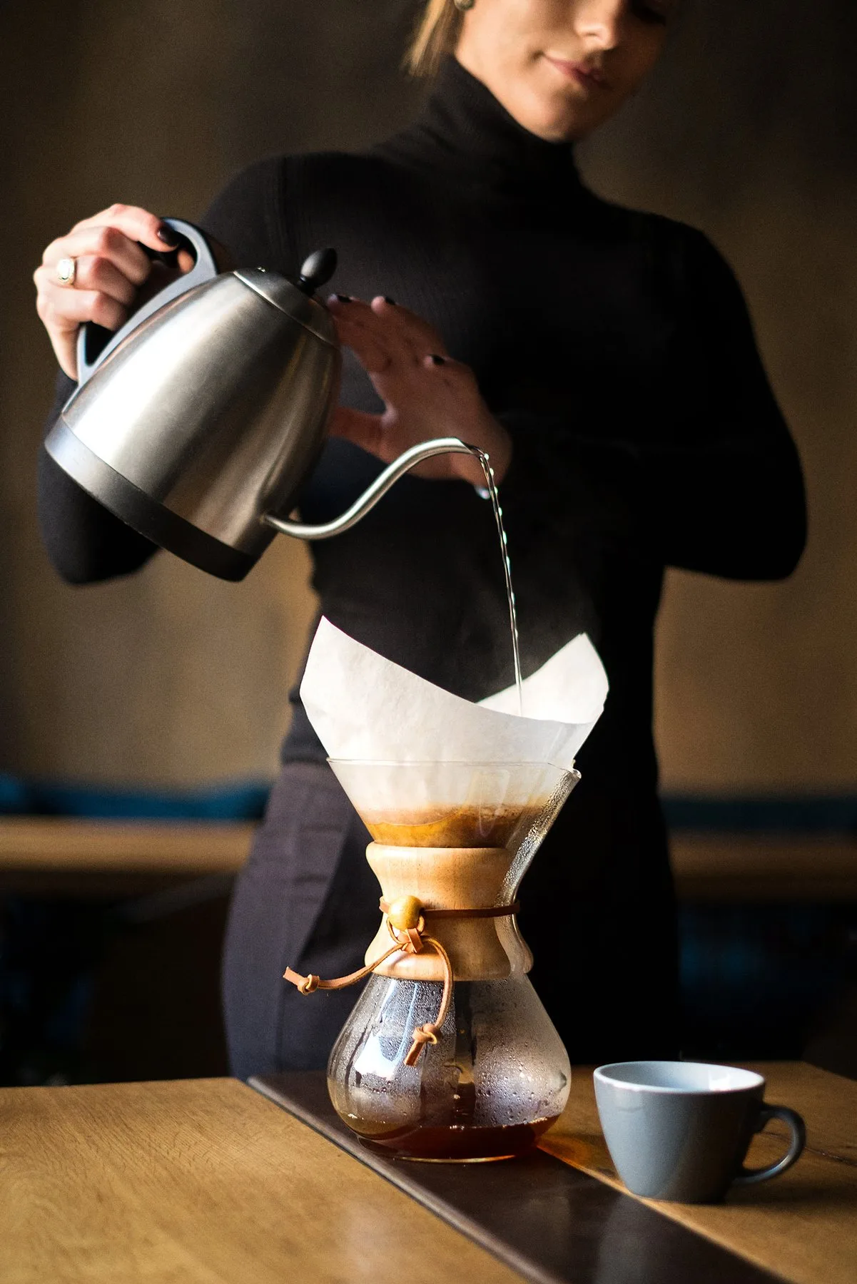 Barista pouring water into a Chemex