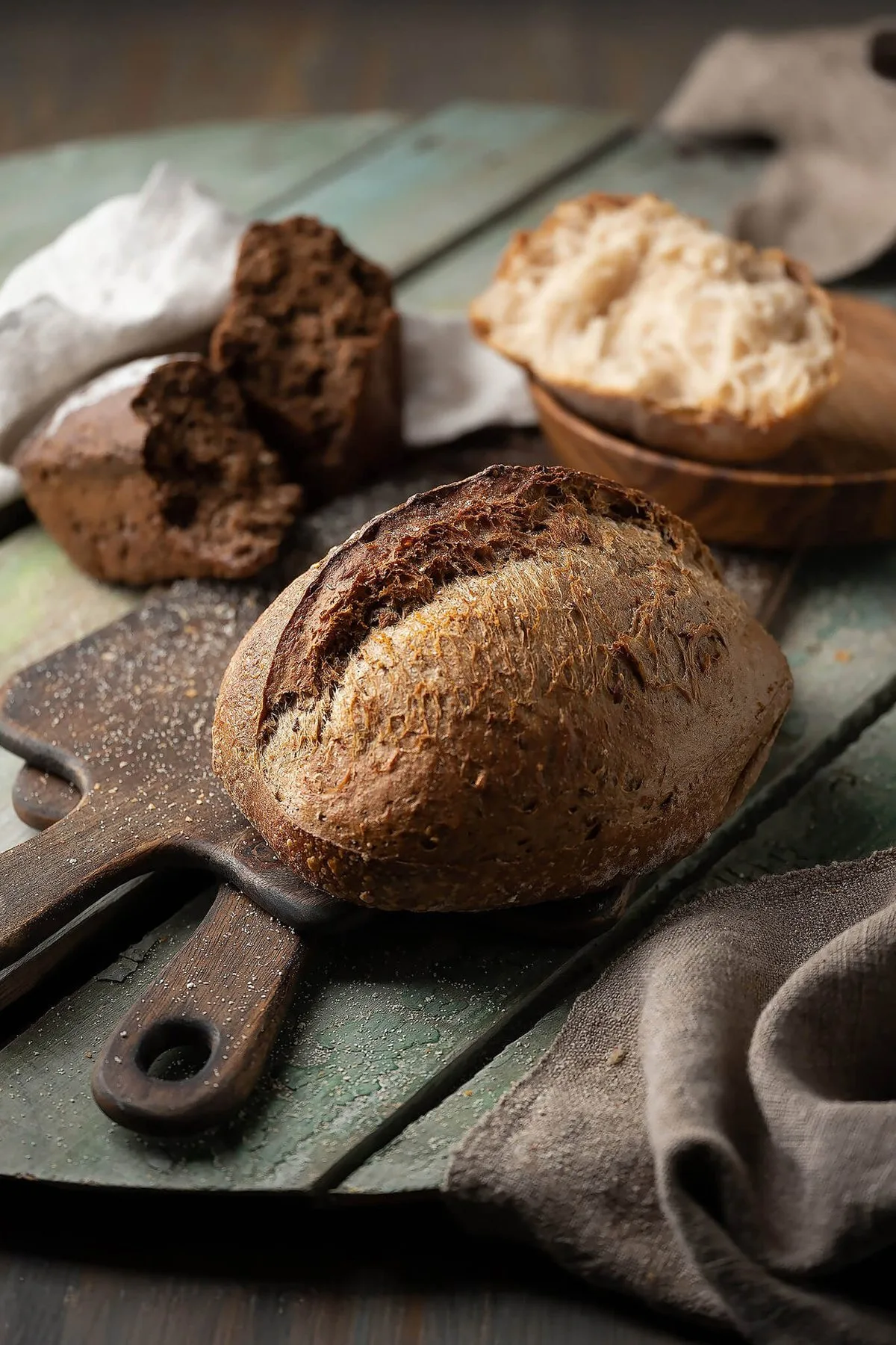 Rustic bread loaves on a wooden board