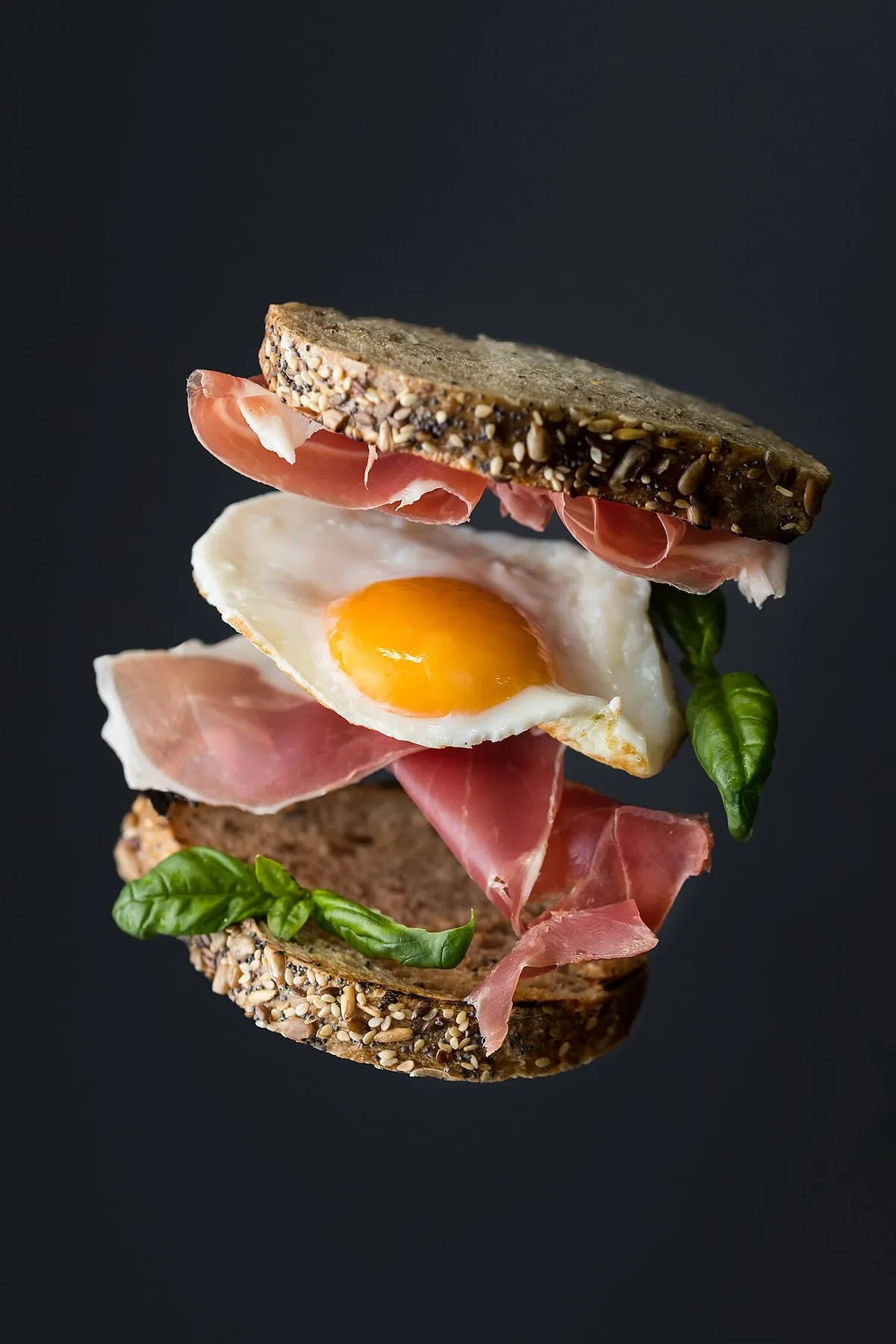 Floating sandwich with ham and a fried egg